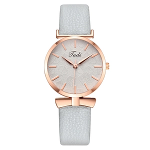 Women's rose gold watch with leaf textured dial and grey leather strap with bow detail