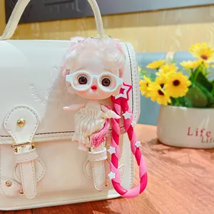 Cute cartoon doll keychain with pink curly hair and star strap for handbag decoration
