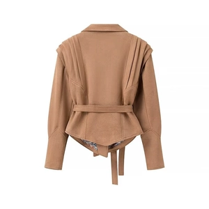 Detail view of camel faux suede jacket showing back waist belt and shoulder pleat texture