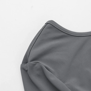 Detail view of the fine gray knit texture and high-quality stitching on the neckline