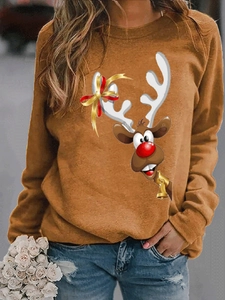 Detail of caramel brown Christmas reindeer print sweatshirt with long sleeves for women