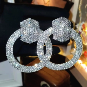 Sparkling silver intertwined C-shaped hoop earrings with micro-inlaid zircons for women