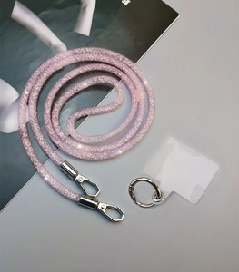 Pink rhinestone phone lanyard with silver clips and a transparent patch detail