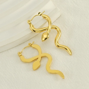 Elegant gold snake hoop earrings with polished mirror finish on textured fabric base