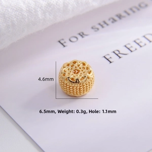 Macro view of S925 sterling silver lotus spacer bead with intricate filigree gold detail