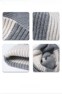 Detail view of two-tone gray and beige thick ribbed knit texture on a winter beanie