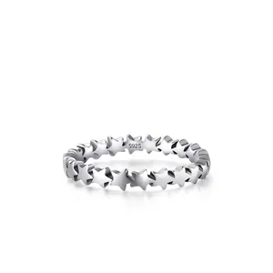Minimalist S925 sterling silver ring with continuous star pattern design in polished finish