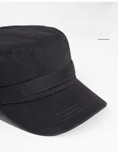 Detailed macro view of black washed cotton military cap with wide brim and fine stitching