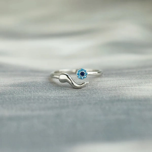 Detail shot of S925 sterling silver evil eye ring featuring a blue gemstone inlay