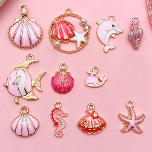 Pink and gold ocean themed enamel charms set with shells and starfish for DIY jewelry