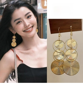 Detail of gold geometric concentric triple circle drop earrings with S925 silver needles
