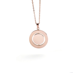 Detailed close-up of rotating rose gold round pendant with a smooth polished finish