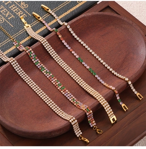 Detailed macro of gold plated tennis bracelets with multi-row colored zircon stones