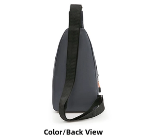 Detail view of the back side of charcoal gray nylon sling bag with orange zipper pull