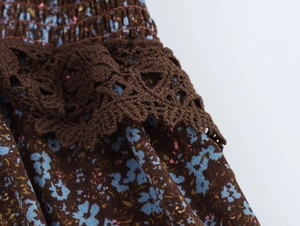 Detailed close-up of brown floral chiffon dress featuring crochet lace trim and elastic waist