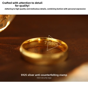Macro detail of S925 sterling silver ring with gold plating and size 7 engraving