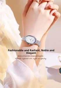 Detail of luxury women watch with mother of pearl oval dial and woven silver strap