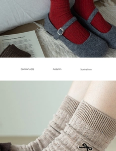 Close-up of knit crew socks with embroidered bows and colorful flecked yarn detail