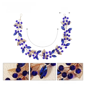 Detail view of 31cm handmade dark blue crystal headband with golden metal leaves