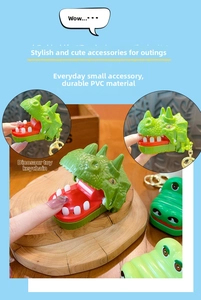 Close-up of PVC dinosaur toy with interactive biting mouth and metal keychain