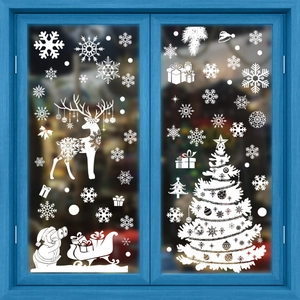 Christmas window stickers set with white snowflakes, reindeer, and Santa Claus on glass