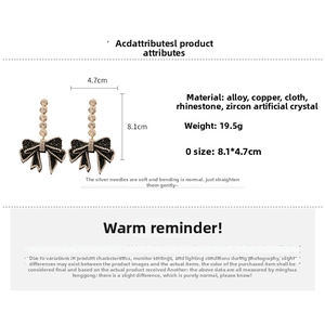 Detailed spec sheet showing oversized crystal bow earrings with 8.1x4.7cm dimensions