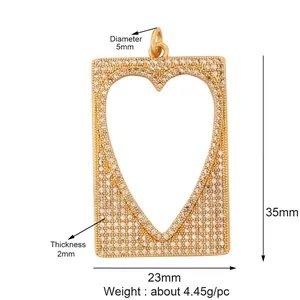 Detailed view of micro-pave gold rectangular pendant with heart cutout and dimensions