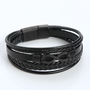 Close-up of black braided leather multi-layer bracelet with matte infinity metal clasp