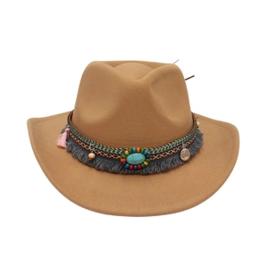 Detailed view of camel felt cowboy hat with turquoise and ethnic fringe band