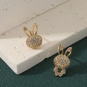 Golden bunny stud earrings with sparkling white zircons and purple gem accents