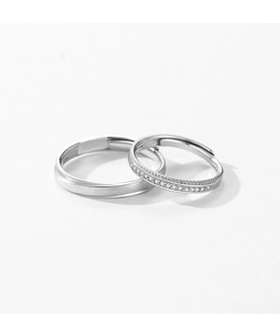 Detail of adjustable couple rings with brushed silver finish and sparkling zircon stones