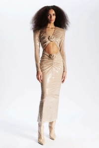 Detail of champagne sequin dress with waist cutout and 3D floral accent on shoulder