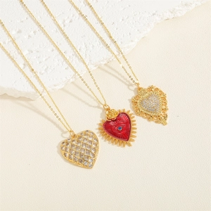 Three elegant heart necklaces featuring red enamel, gold filigree, and zircon pendants