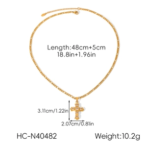 Detailed view of golden cross pendant necklace with size dimensions and specifications