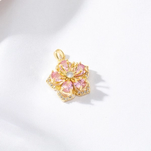 Pink heart-shaped flower pendant with micro-pave zircons in gold-plated finish