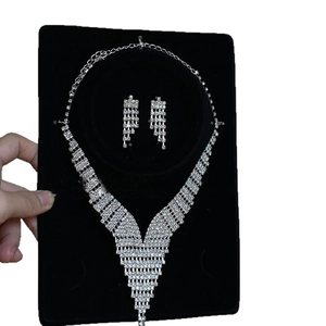 Elegant silver V-shaped tassel necklace and earrings jewelry set with sparkling rhinestones