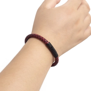 Men's braided red leather bracelet with black magnetic clasp on white background