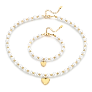 Beaded pearl necklace and bracelet set with gold heart charms for a beach summer style