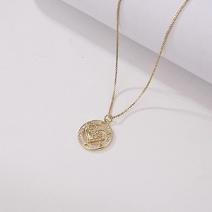 Detailed close-up of golden sun-flower pendant necklace with sparkling zircon heart detail