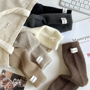 Thick autumn winter thermal socks in assorted solid colors with stylish fabric labels