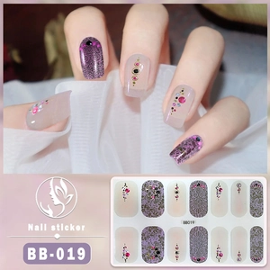 Close-up of 5D BB-019 nail stickers with purple lace patterns and colorful rhinestones