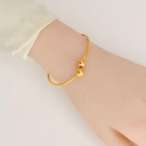 Elegant 18K gold plated 304 stainless steel open cuff bracelet with double beads on model
