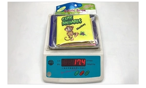 Detailed weight measurement of baby soft book showing animal theme at 17.4 grams