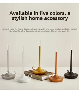 Detail of five modern LED table lamps in assorted colors with sleek metal bases and rings