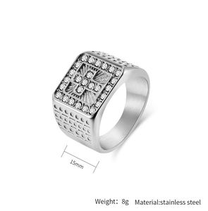 Detail view of 15mm silver stainless steel ring with micro-pave cross and brushed side textures