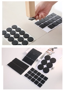 Detail of self-adhesive black non-slip furniture pads in various shapes for chair legs