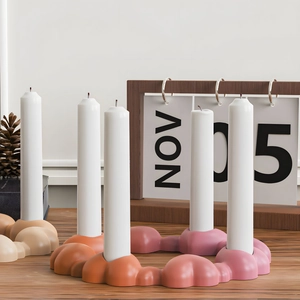 Cloud-shaped candle holder with four slots in beige and warm gradient finishes