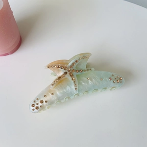 Elegant starfish acetate claw clip with rhinestones in green and orange gradient