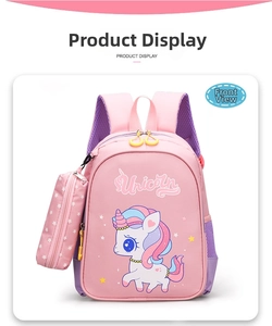 Close-up of pink unicorn cartoon schoolbag with mesh side pocket and star pencil case