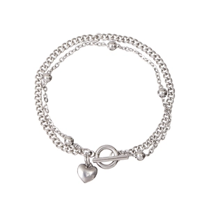 Detail of silver double-layer bracelet with heart pendant, round beads and OT toggle clasp